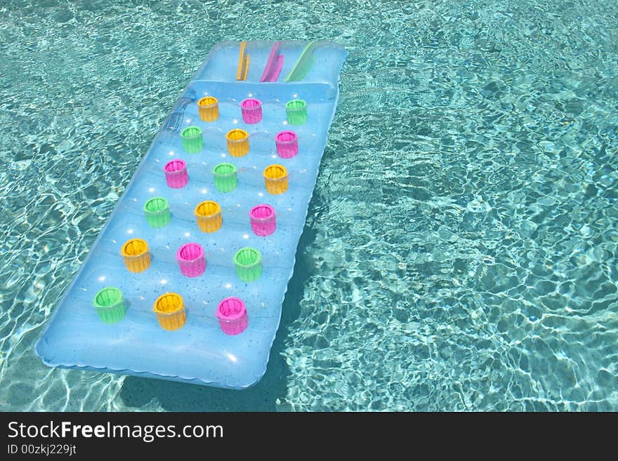 Raft floating in clear swimming pool. Raft floating in clear swimming pool