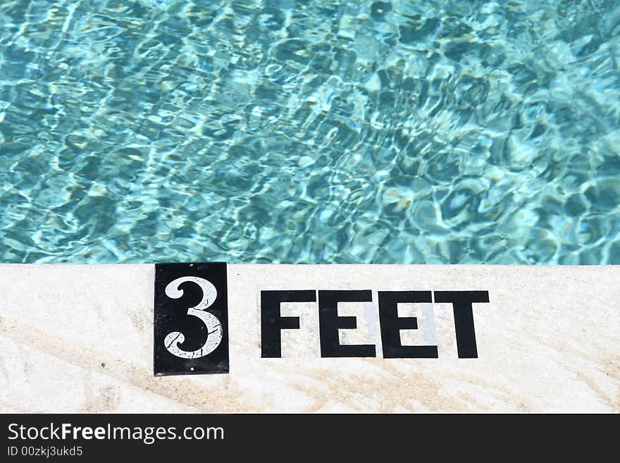 3 Feet depth marking on swimming pool deck. 3 Feet depth marking on swimming pool deck