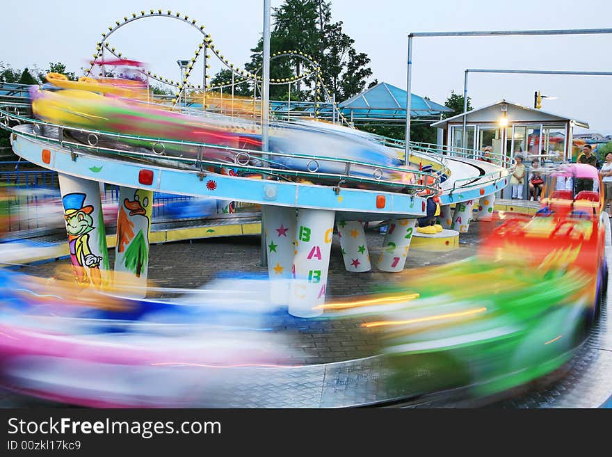 Motion car in amusement park/long time shot