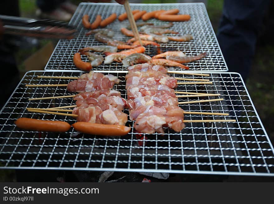 BBQ with variety of foods being prepared