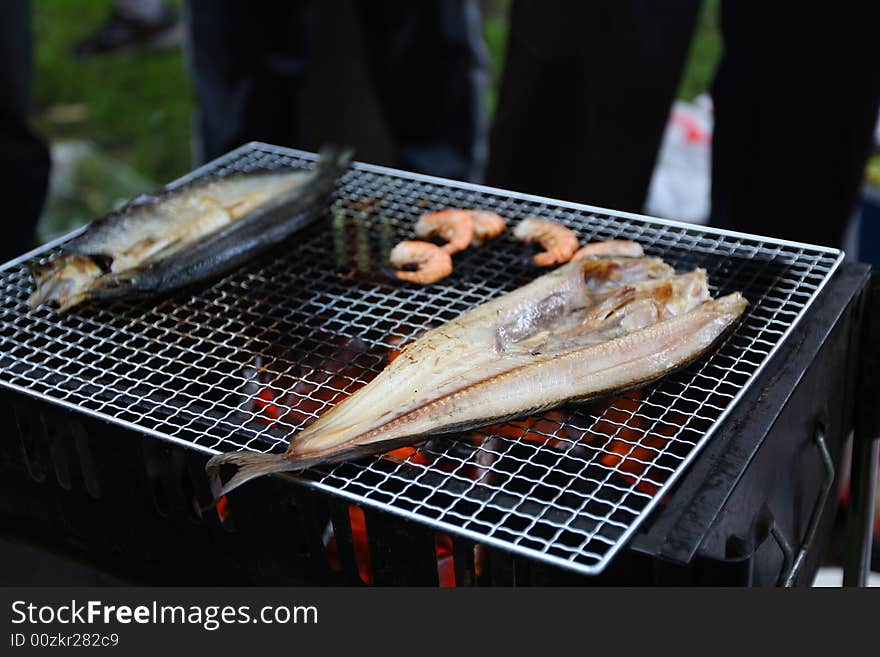 BBQ with variety of foods being prepared