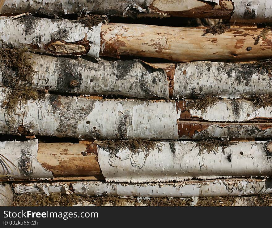 A background of a pile of wood. A background of a pile of wood