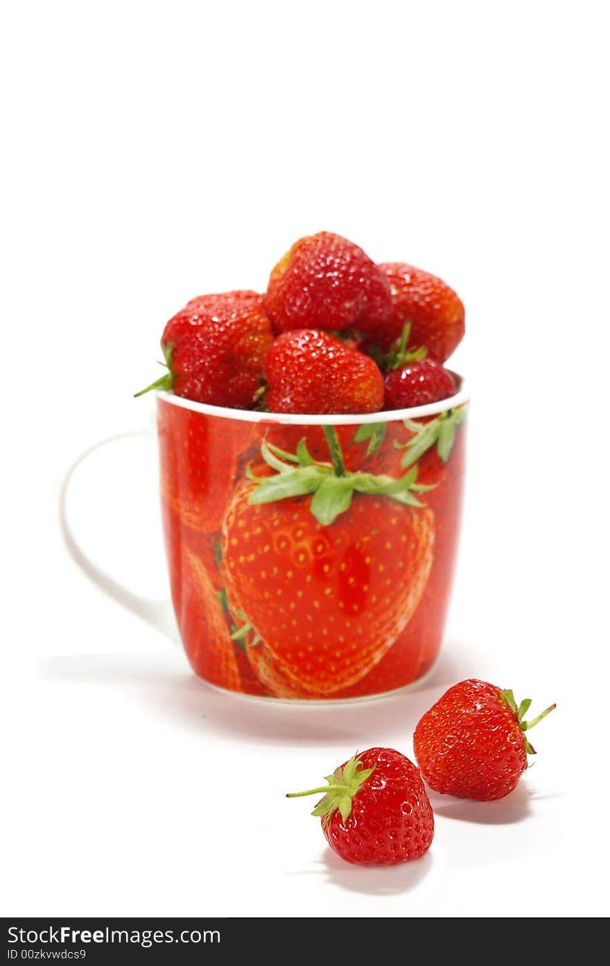 Ripe strawberry in the cup isolated on white background