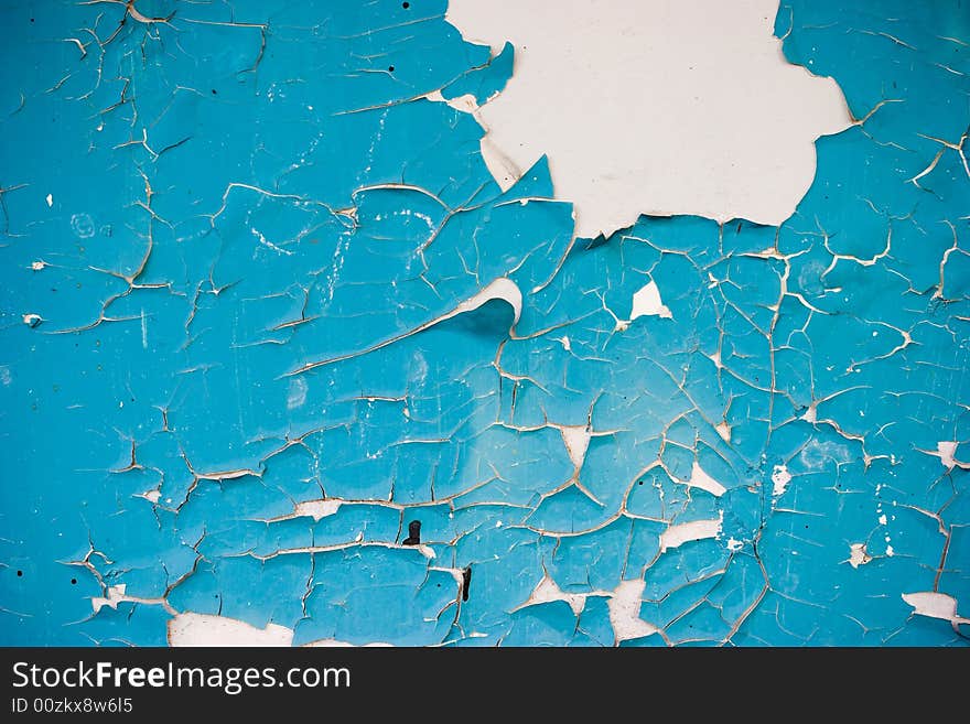 Blue peeling paint on the white wall grunge background