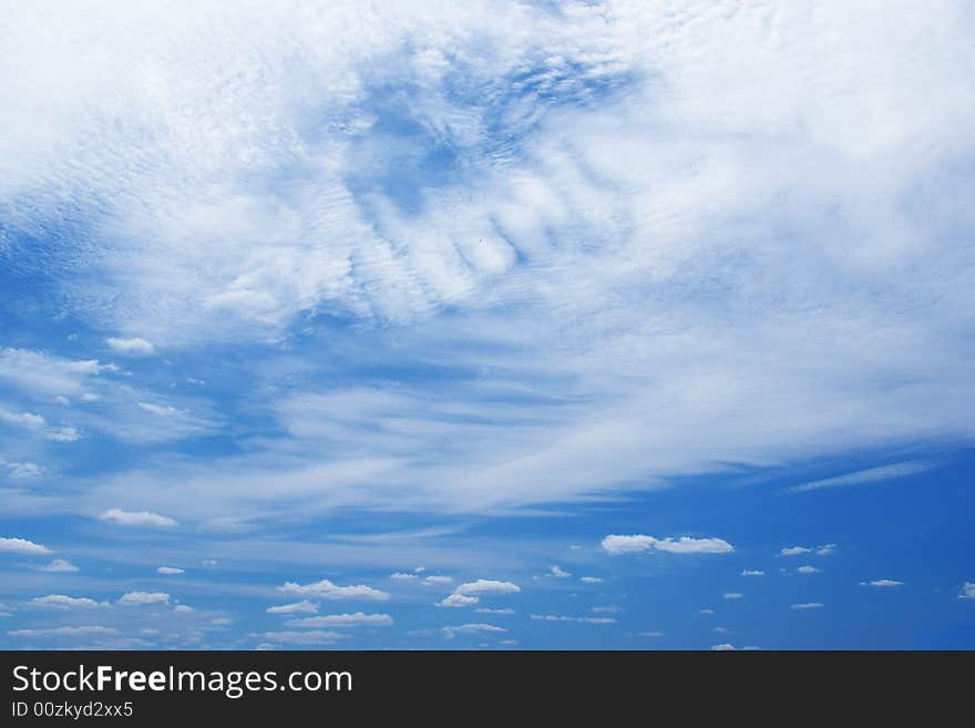 White clouds in a blue sky. Great background. White clouds in a blue sky. Great background