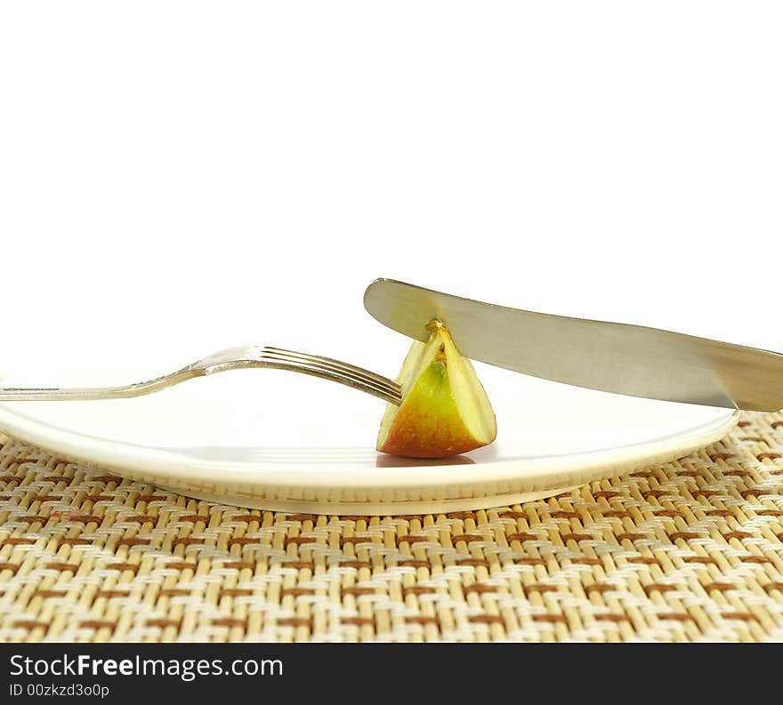 Ripe juicy apple on a white plate