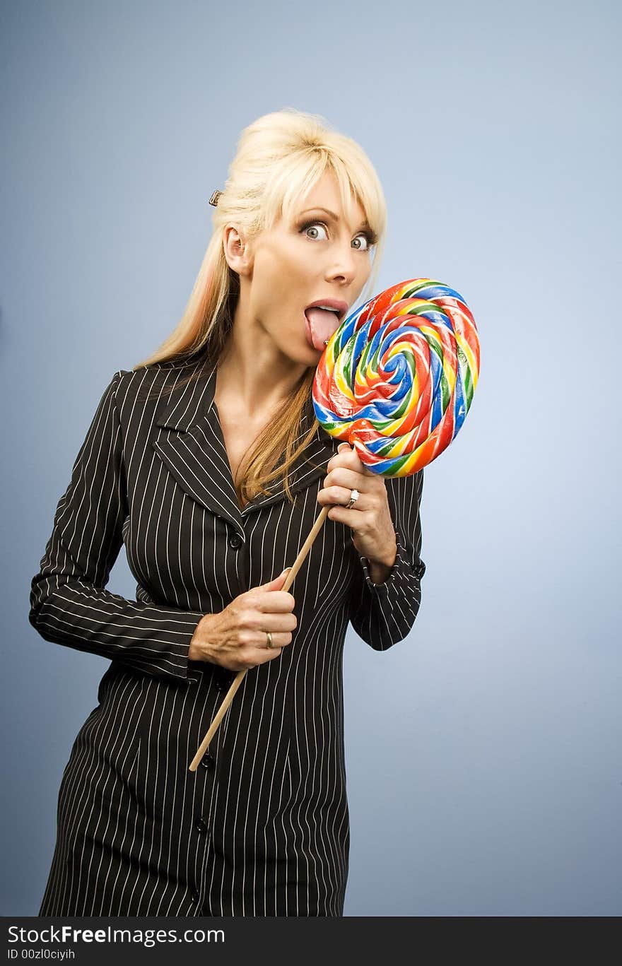 Woman Licking A Lollipop