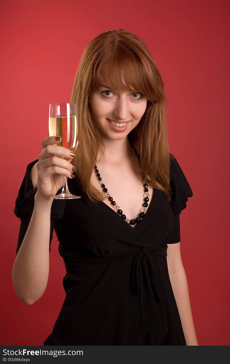 Beautiful girl with champagne glass isolated on red background