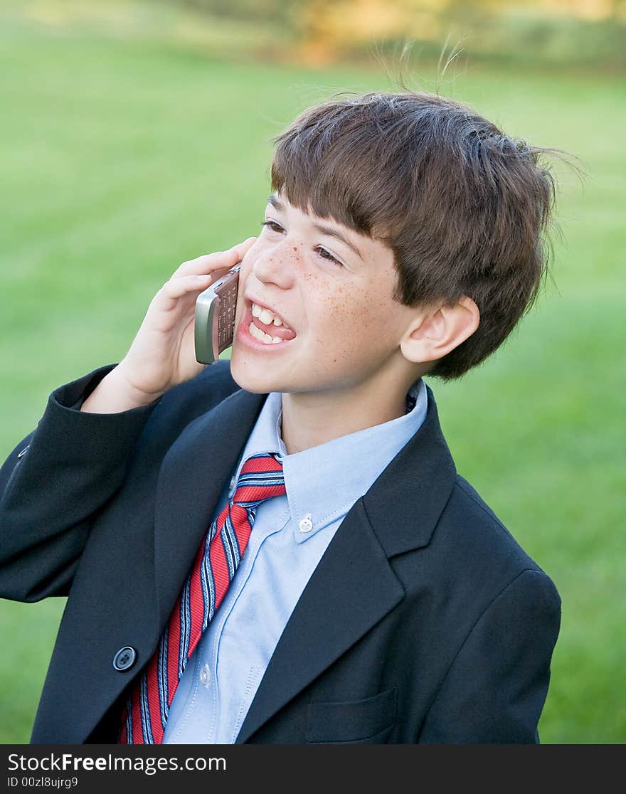 Little Business Man Talking on Cell Phone. Little Business Man Talking on Cell Phone