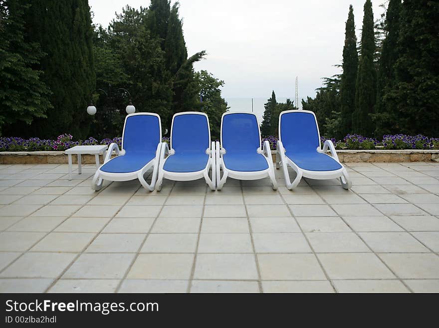 Chairs by swimming pool side. Chairs by swimming pool side