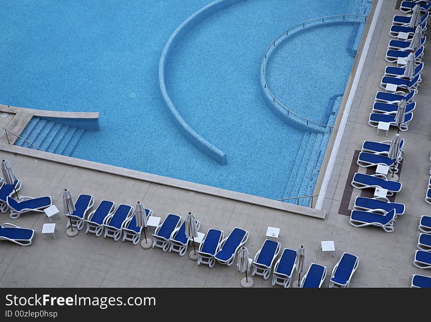 Swimming pool side with chairs