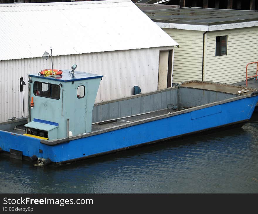 Blue fishing boat on the water