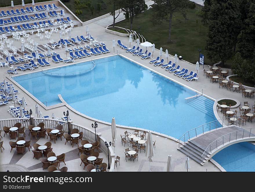 Swimming pool side with chairs