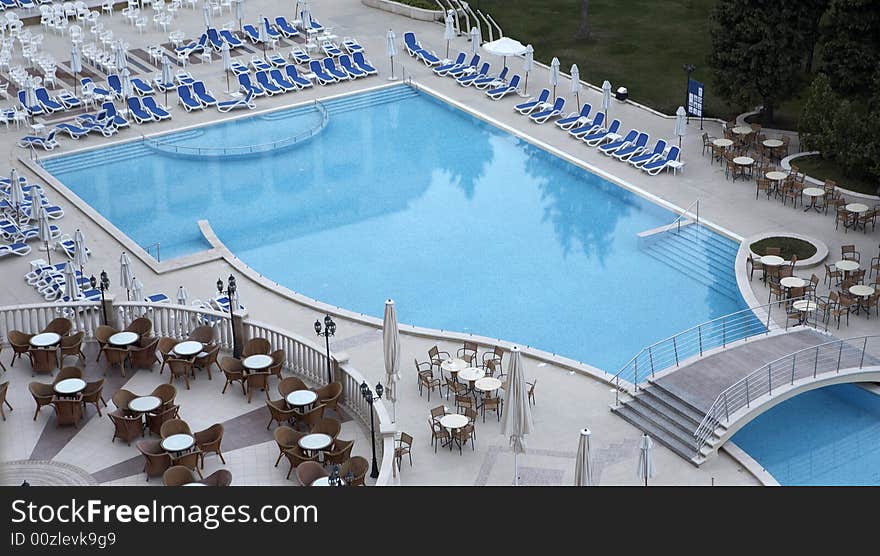 Swimming pool side with chairs