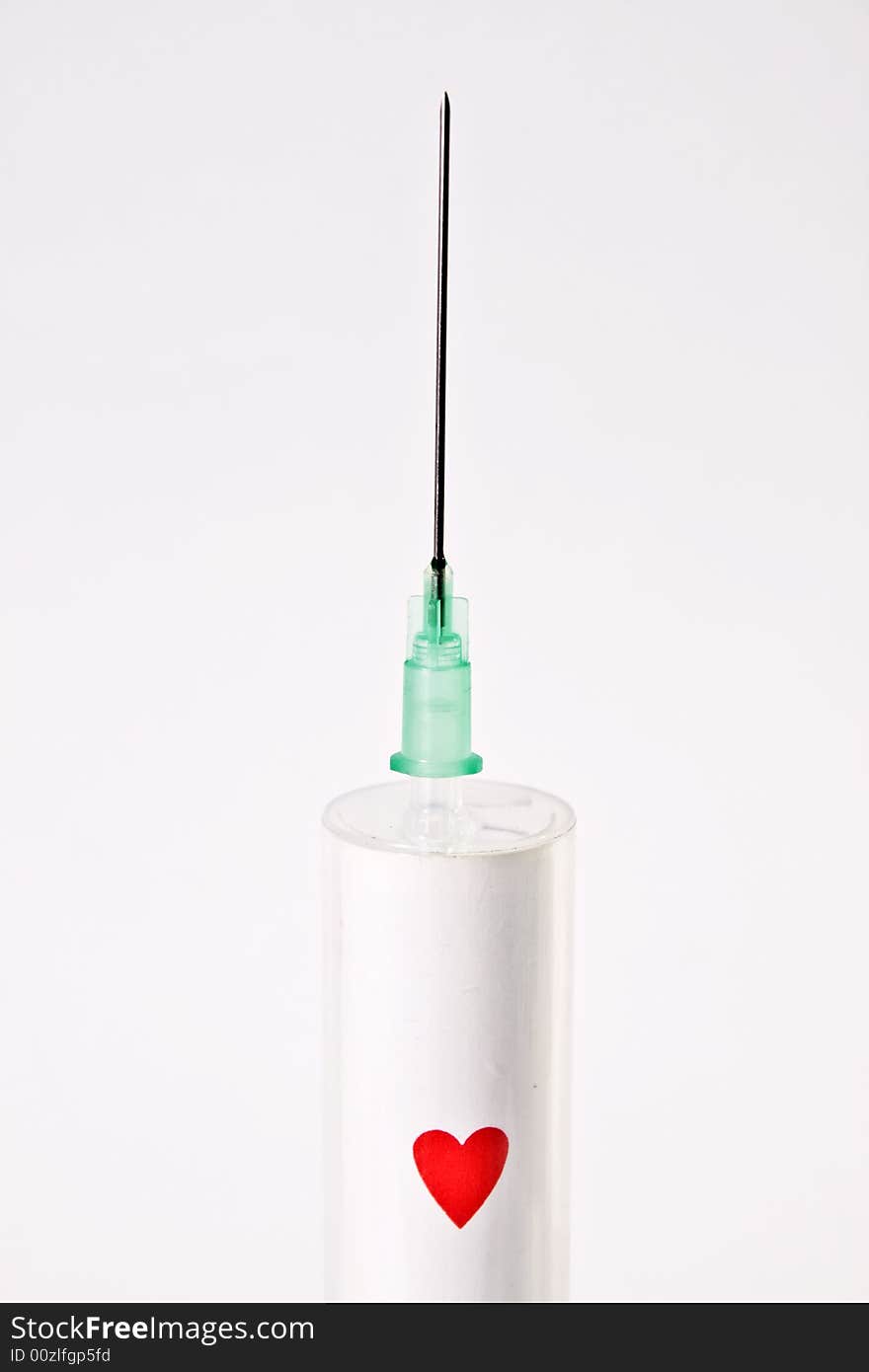 Syringe with heart plaing card