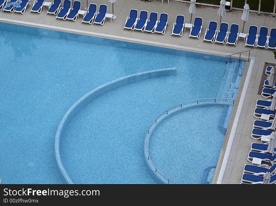 Swimming pool side with chairs