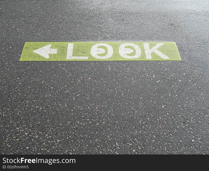 Green look sign painted on the pavement