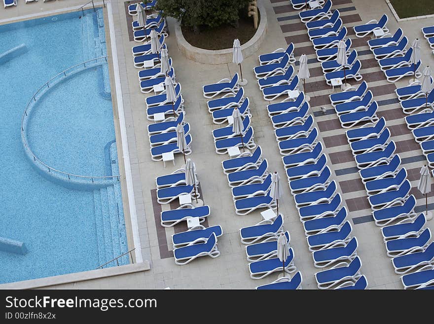 Chairs by swimming pool side. Chairs by swimming pool side