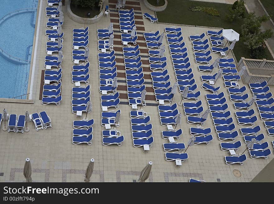 Chairs by swimming pool side. Chairs by swimming pool side