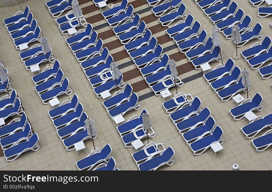 Chairs by swimming pool side. Chairs by swimming pool side