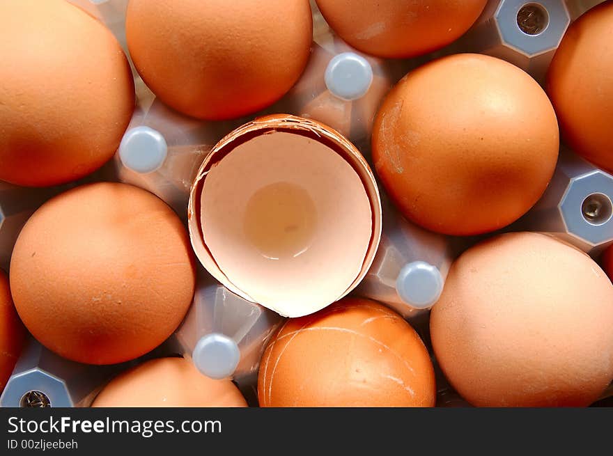 A set of brown eggs in a plastic tray. A set of brown eggs in a plastic tray