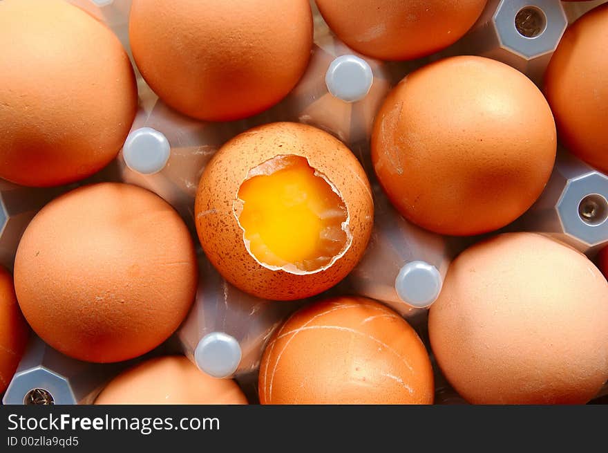 A set of brown eggs in a plastic tray. A set of brown eggs in a plastic tray