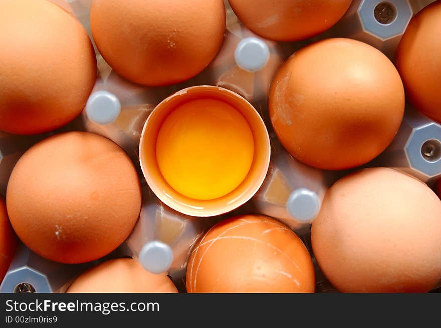 A set of brown eggs in a plastic tray. A set of brown eggs in a plastic tray