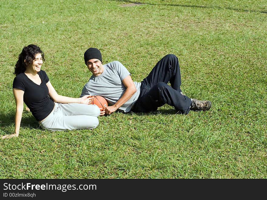 Man and Woman Sitting on Grass - Horizontal