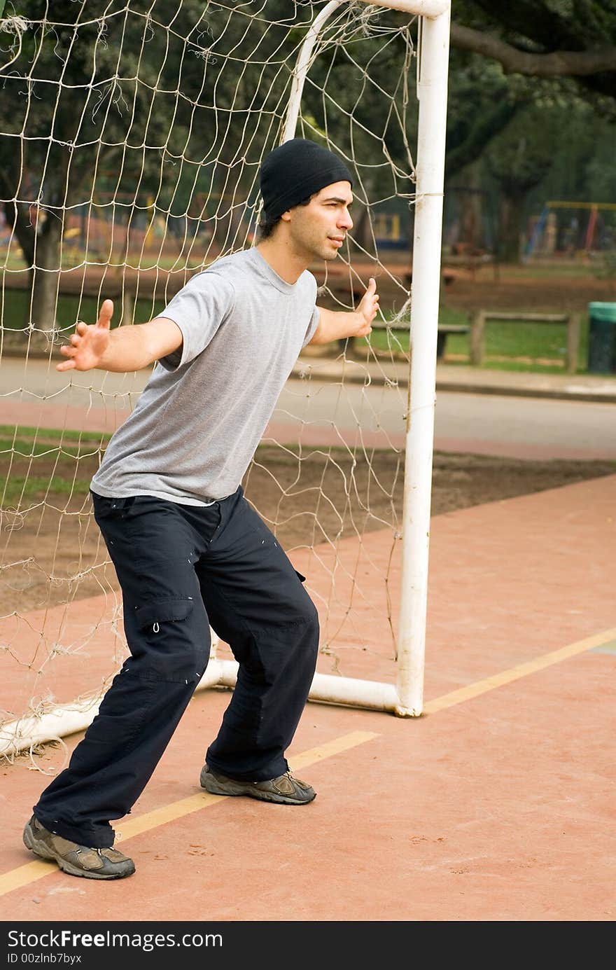 Man in Goalie Box - vertical