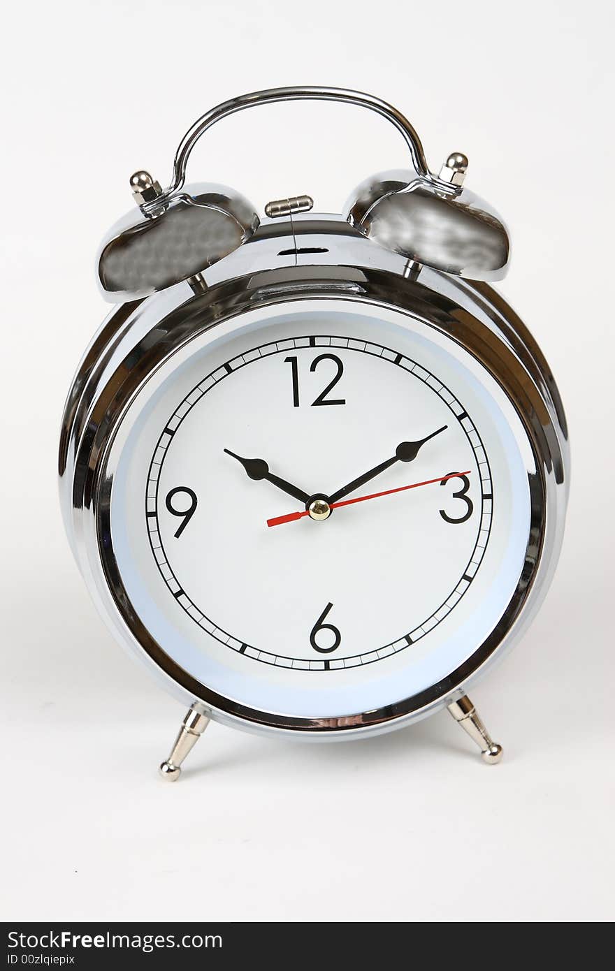 Photo of a chrome analog alarm clock