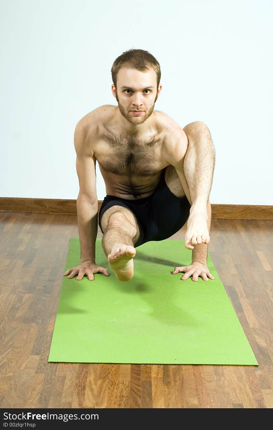 Man Holding Himself Up By Arms - Vertical