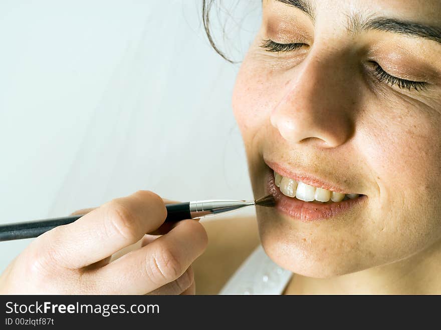 Woman Putting on Make-up - horizontal