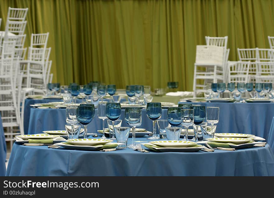 Getting ready for a party; table setting and chairs. Getting ready for a party; table setting and chairs.