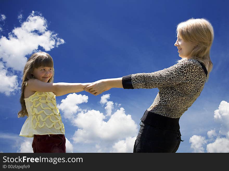 The mother and the daughter against the sky. The mother and the daughter against the sky