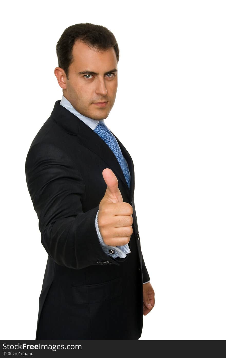 Portrait of a young attractive businessman giving the thumbs-up sign. Portrait of a young attractive businessman giving the thumbs-up sign