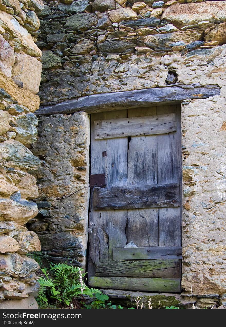 Italy. Lanzo Torinese. Where rocks meet wood. Italy. Lanzo Torinese. Where rocks meet wood