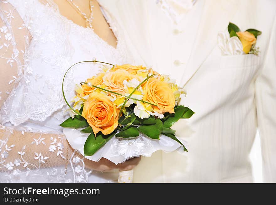 Groom and bride with bouquet