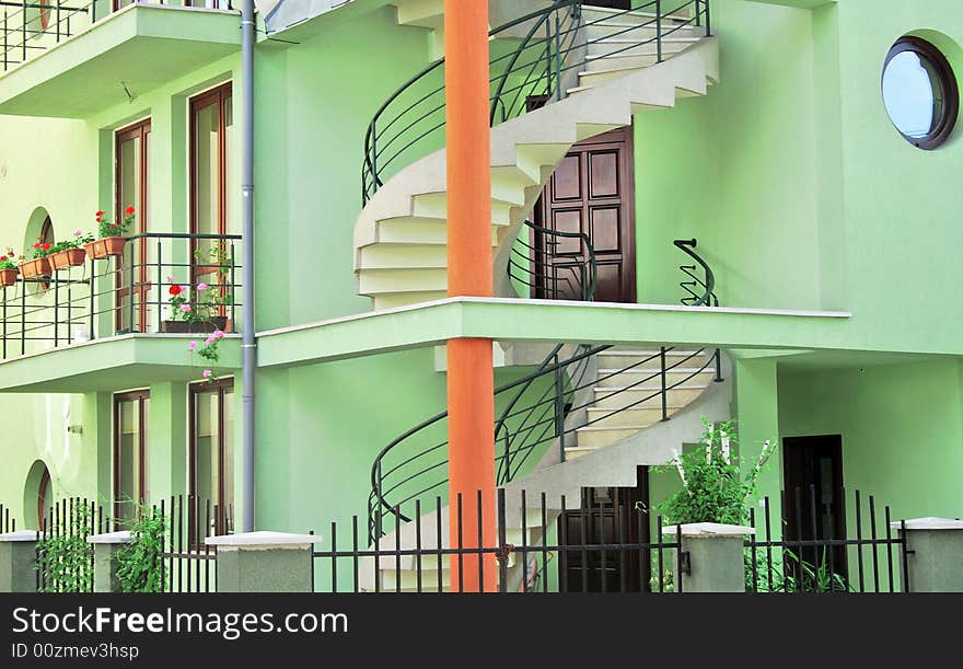 Green building with outdoor spiral staircase. Green building with outdoor spiral staircase