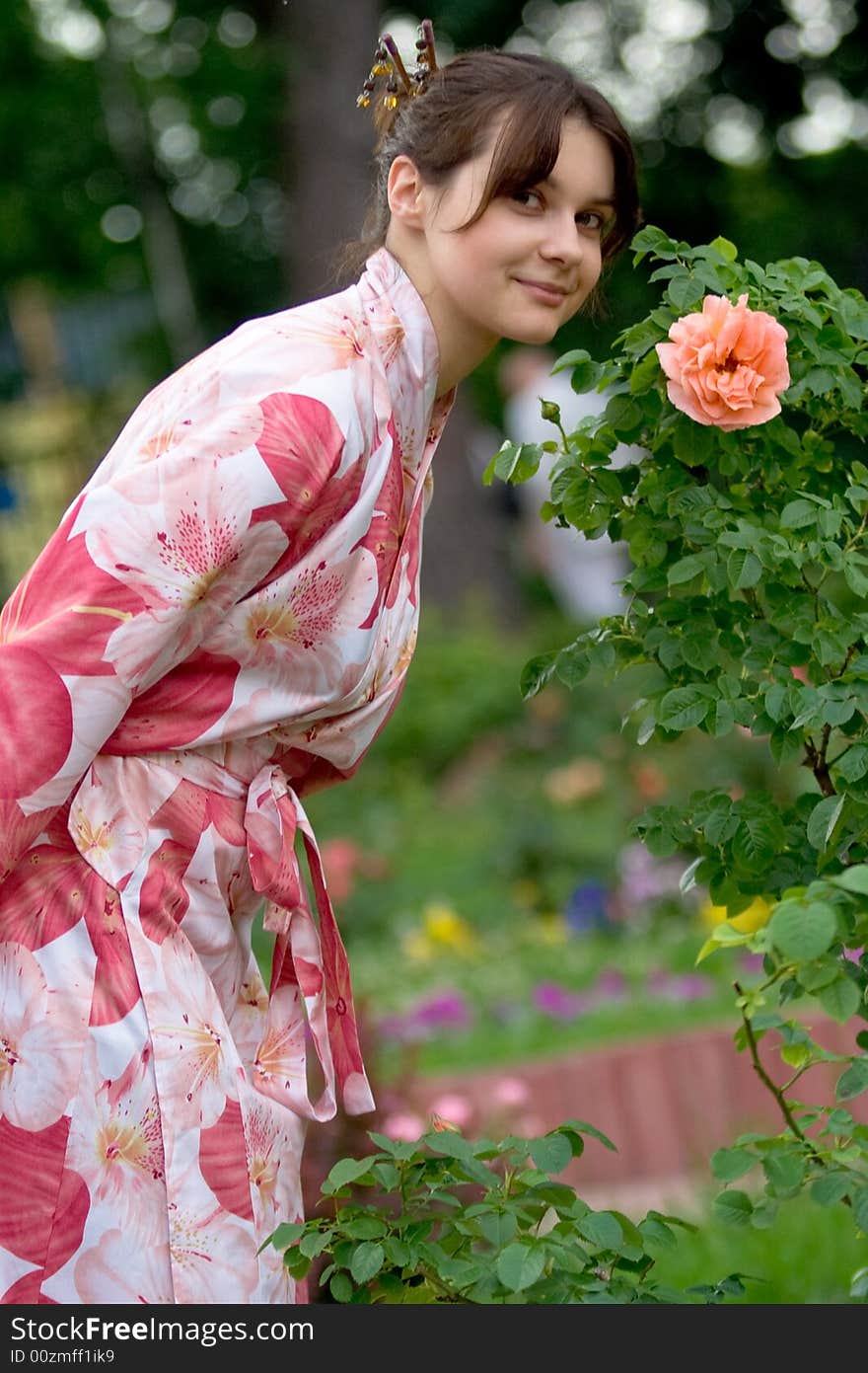 Girl in a pink yukata with rose. Girl in a pink yukata with rose