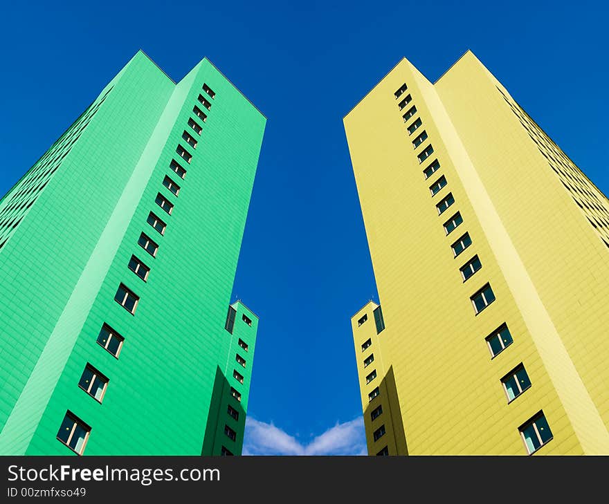 Two colored modern city twin towers. Two colored modern city twin towers