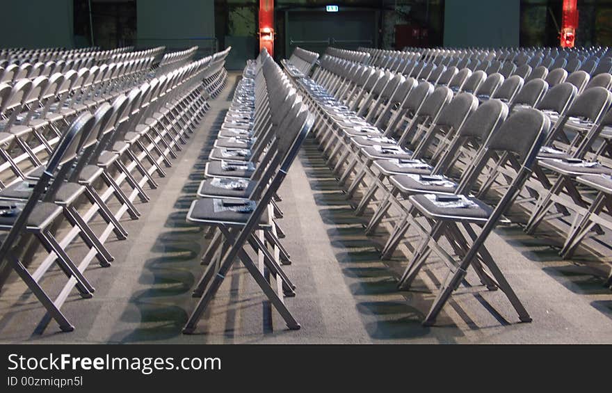 Many chairs put in rows for a congress. Many chairs put in rows for a congress