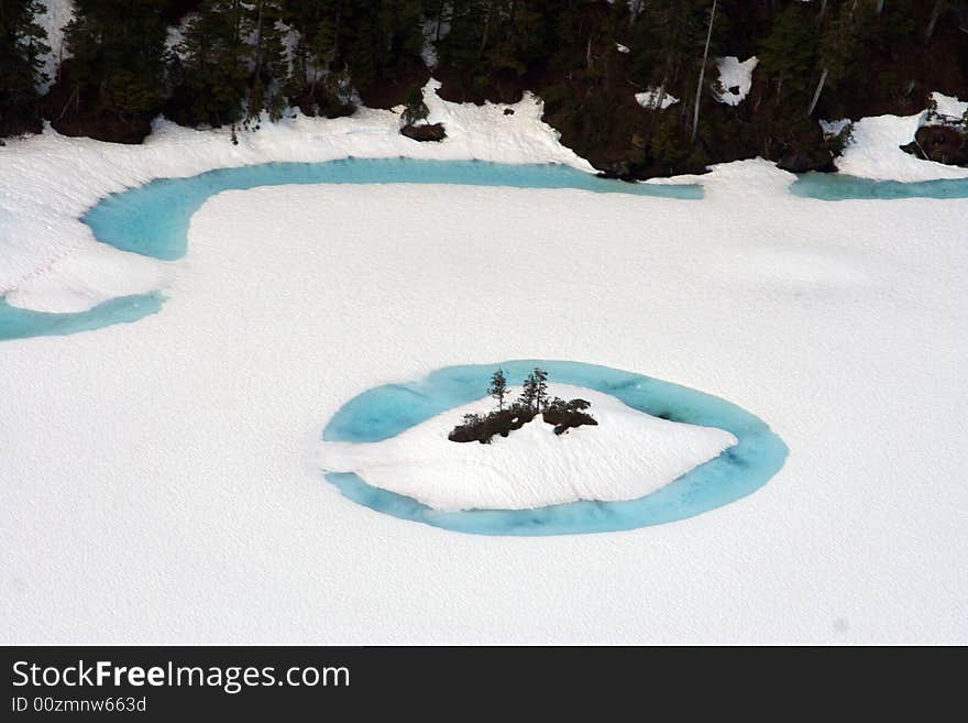 Mountain frozen pick with blue water in ketchikan alaska . Mountain frozen pick with blue water in ketchikan alaska