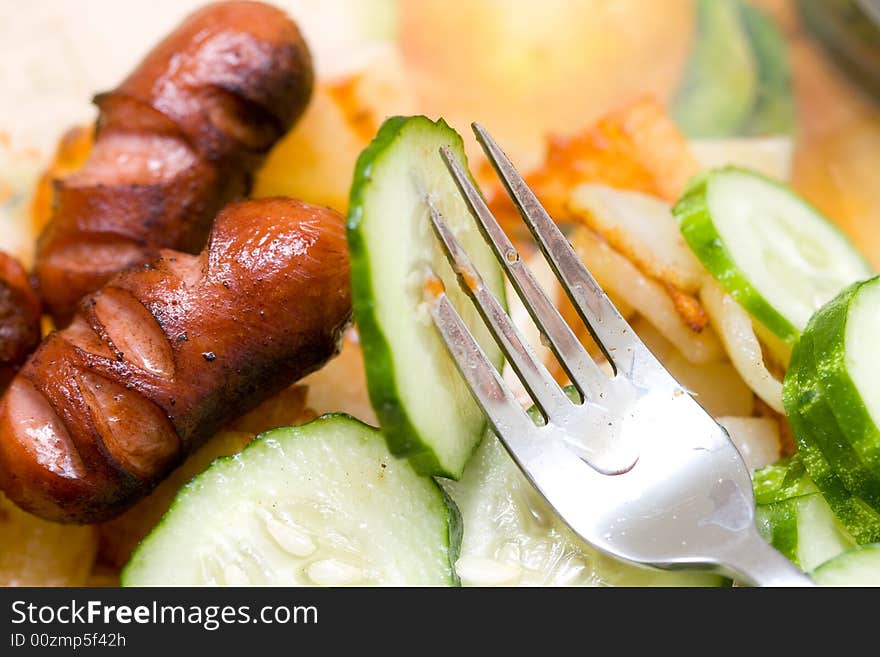 Potato and cucumber on a glass plate. Potato and cucumber on a glass plate