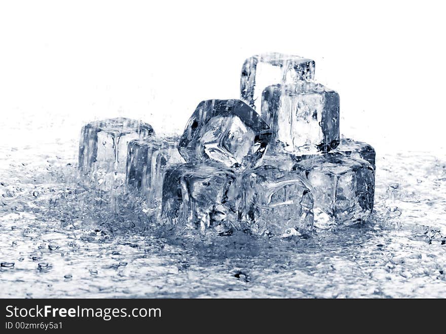 Melting ice cubes in water on white background. Melting ice cubes in water on white background