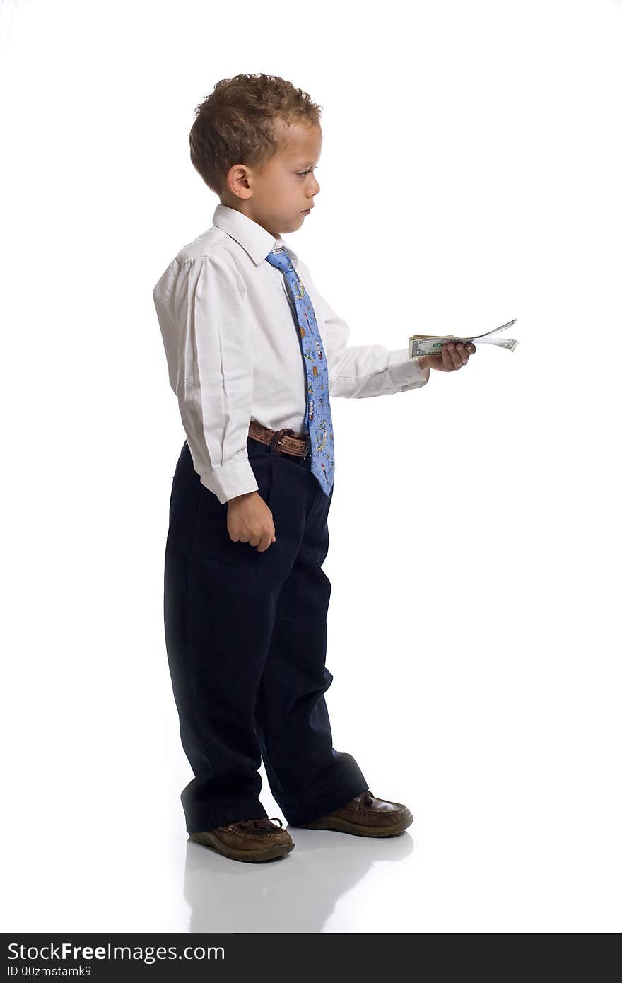 Young boy dressed as businessman holds money - isolated on white