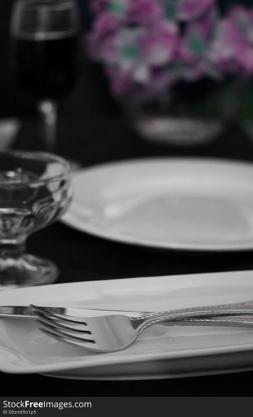 A detail shot of a table set for dinner at a weddign reception. A detail shot of a table set for dinner at a weddign reception