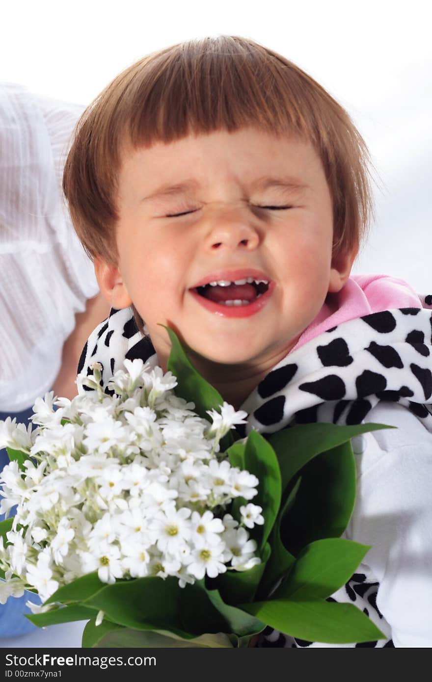 Sweet Smile Little girl taking white flowers isolated on the white background. Sweet Smile Little girl taking white flowers isolated on the white background