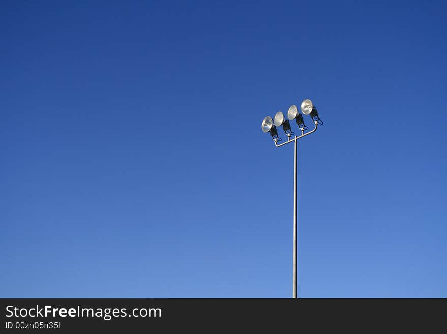 Sunny sky and floodlight pole