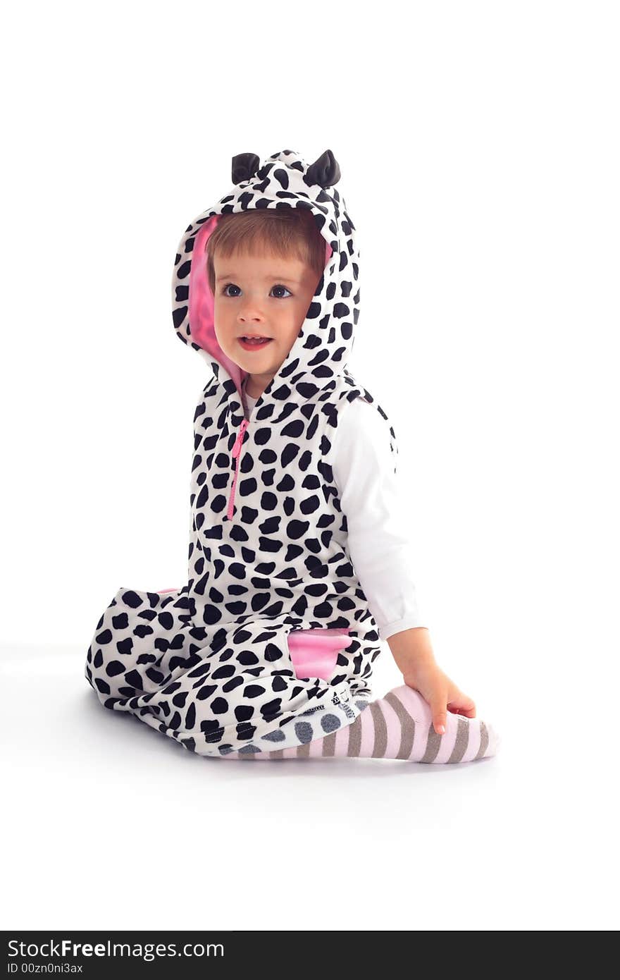 Little girl sitting on the floor isolated on the white background. Little girl sitting on the floor isolated on the white background