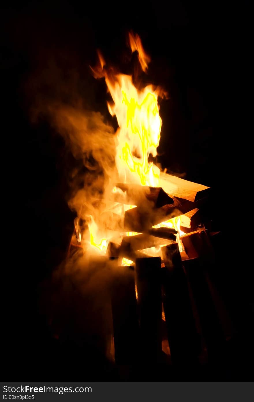 Firewood flaming on black background. Firewood flaming on black background